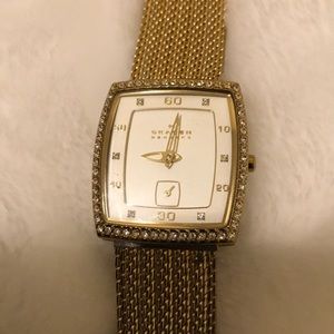 Women’s Skagen Gold tone watch.